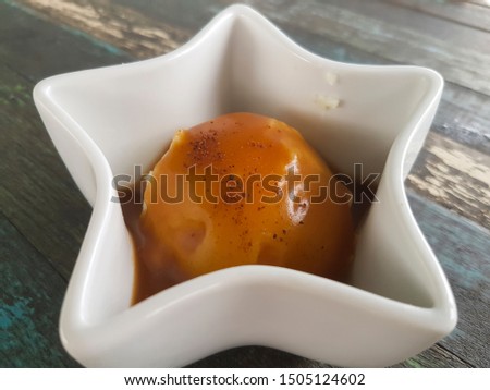 Mashed potatoes pour gravy in a star-shaped cup Royalty-Free Stock Photo #1505124602