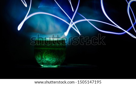 green luminous glass with pattern and abstraction of luminous lines