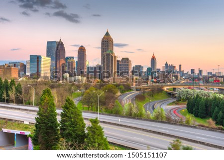 Atlanta, Georgia, USA downtown city skyline over highways at dusk.