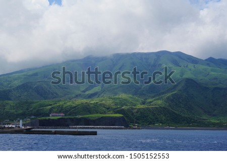 Miyakejima seen from a passenger ship traveling in the Pacific Ocean Royalty-Free Stock Photo #1505152553