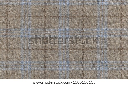 Expensive men's suit. Virgin wool extra fine. Beige with light blue cross. Glenurquhart check is made of cashmere fabric. Traditional Scottish Glen plaid Royalty-Free Stock Photo #1505158115