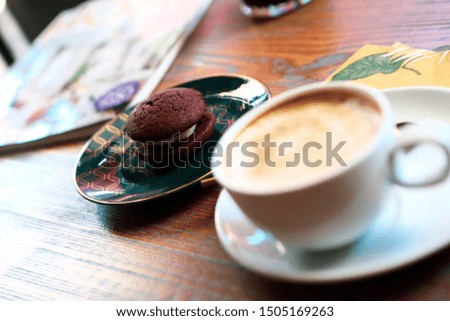 Delicious cookies with a cup of coffee