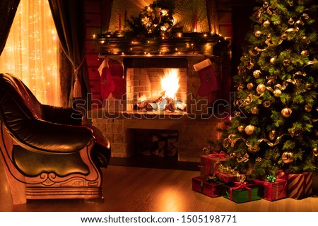 Christmas living room interior with decorated fireplace, armchair and xmas tree