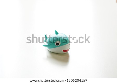 Selective focus on cute shark kid toys isolated on white background