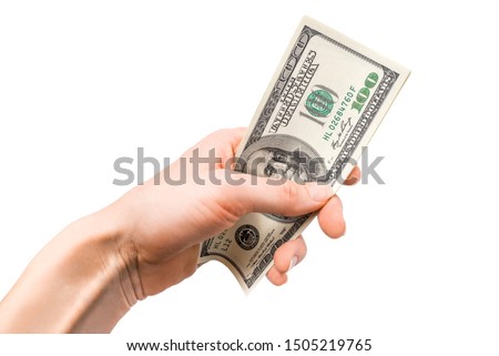 Dollars in woman hand isolated on white background. Close up. Business concept.