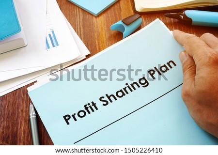 Profit Sharing Plan in the hands of a man. Royalty-Free Stock Photo #1505226410