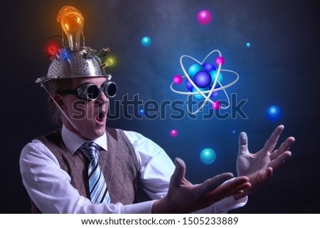 Nerd with tin foil hat presenting Atom icon symbol