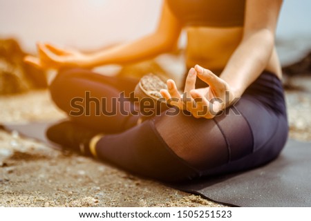 Close up hands. Woman do yoga outdoor.Healthy and Yoga Concept. Lotus Pose. Welness background.