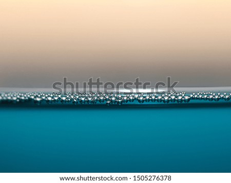 Macro surface, clear Blue water background, underwater with bubbles and water surface and Copy space , Light,Flare