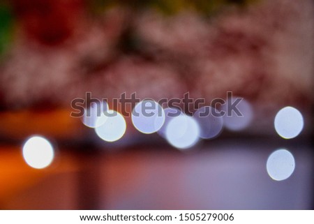 Abstract texture with light blue bokeh and black background