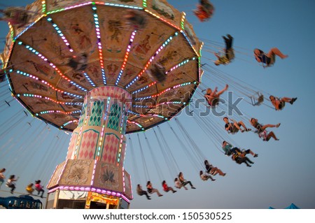 Swing ride at fair Royalty-Free Stock Photo #150530525