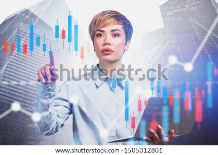 Beautiful young business consultant with laptop working with digital graphs in city. Concept of stock market. Toned image double exposure