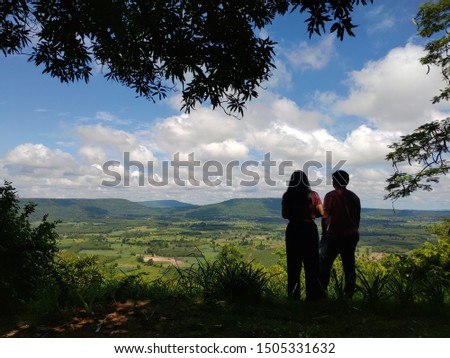The shadow of people standing to take pictures at the viewpoint The landscape and blue sky with beautiful white clouds  landscape copy space and backgrounds or backgrounds