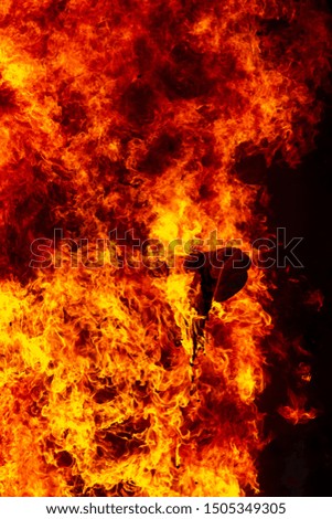 Flame of fire from a burning house as an abstract background.