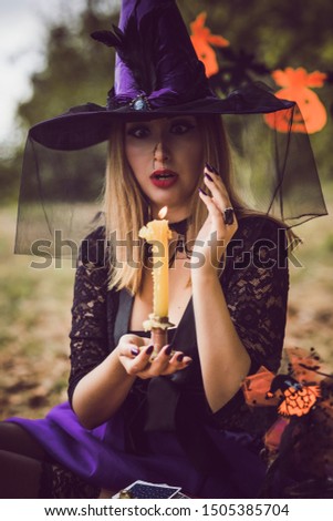 Halloween holiday funny face witch Lady set the veil on fire 