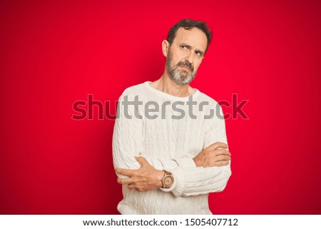 Handsome middle age senior man with grey hair over isolated red background looking sleepy and tired, exhausted for fatigue and hangover, lazy eyes in the morning.