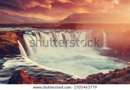 Godafoss waterfall with dramatic colorful sky during sunset, Icelandic nature scenery Amazing long exposure scenery of famous landmark in Iceland. Creative image best locations for photographers