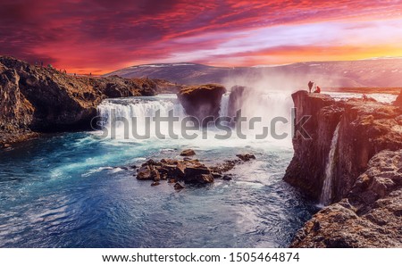 Godafoss waterfall with dramatic colorful sky during sunset, Icelandic nature scenery Amazing long exposure scenery of famous landmark in Iceland. Creative image best locations for photographers
