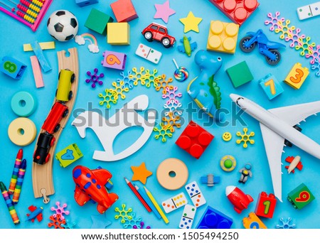 Set of kids toys on blue background. Top view, flat lay.  Royalty-Free Stock Photo #1505494250