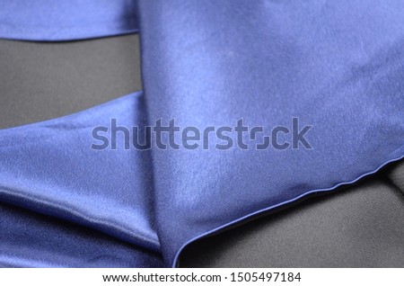 Two tone of blue and black tones beautiful satin fabric background.