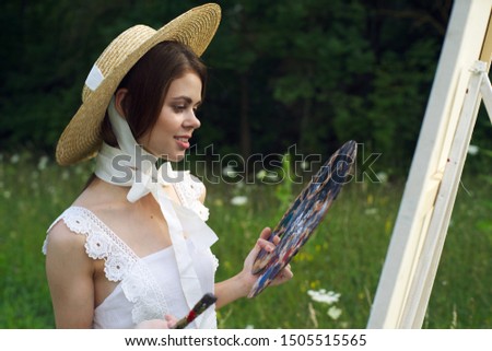 woman outdoors painting creative landscape