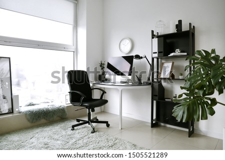 Interior of room with comfortable designer workplace Royalty-Free Stock Photo #1505521289