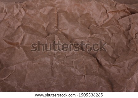 Old crumpled craft paper texture background. Packaging process. 