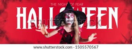 Little girl like a vampire on scary red background. Caucasian female model in red dress scaring. Halloween, black friday, cyber monday, sales, autumn concept. Flyer for your ad. The night of fear.