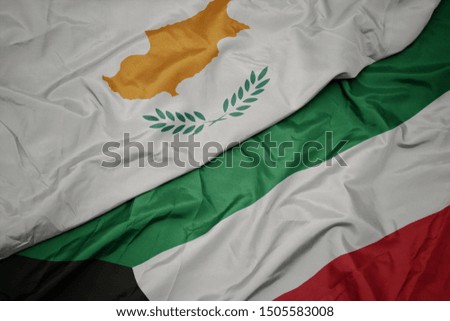 waving colorful flag of kuwait and national flag of cyprus. macro