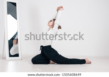Professional model girl doing yoga
