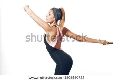 sportswear woman with headband and muscles on the arms