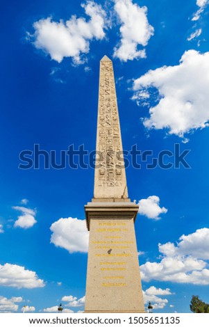 Shot of the Egyptian Obelisk of the Place de la Concorde square in Paris France, with its inscriptions and symbols of Egypt in golden hieroglyph, a beautiful summer day