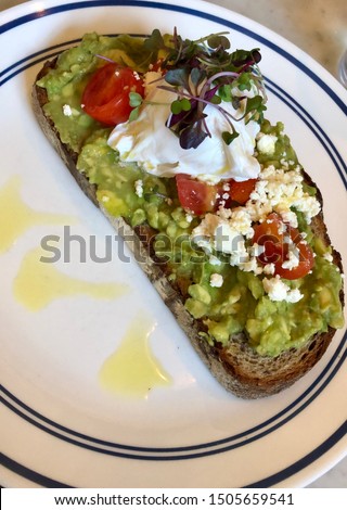 The ultimate avocado toast with feta, cherry tomatoes and a perfectly poached egg. 