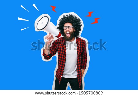 Fashion portrait of emotional hipster man with megaphone in stylish sunglasses. Sales man using megaphone yelling. Discount, sale, season sales. Royalty-Free Stock Photo #1505700809