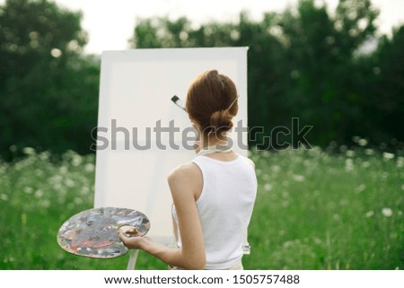 woman palette and paints canvas brush artist young painting