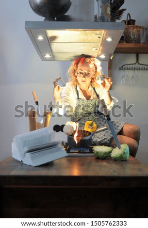 Woman portrait dressed in apron and cooking at the kitchen.food photography concept.