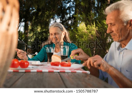 Happy senior couple having breakfast outdoor