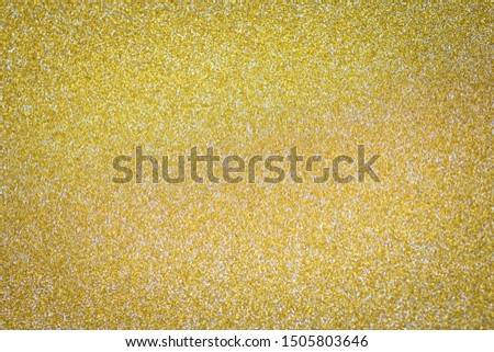 Gradient golden sparkle fine light happy new year wallpaper pattern. 
Dust silver gold glitter Christmas texture background. 
top view.