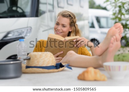 picture of a woman outside the camping car