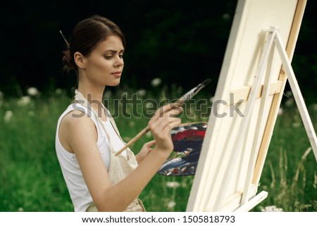 woman artist painting brush beauty canvas white paint oil