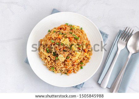 Chinese Asian Egg and Vegetable Fried Rice on a White Plate on the White Background Directly Above Photo. Royalty-Free Stock Photo #1505845988