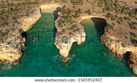 Aerial drone photo of iconic caves of Xylobatis or Ksylompatis in Koufonisi island, Small Cyclades, Greece