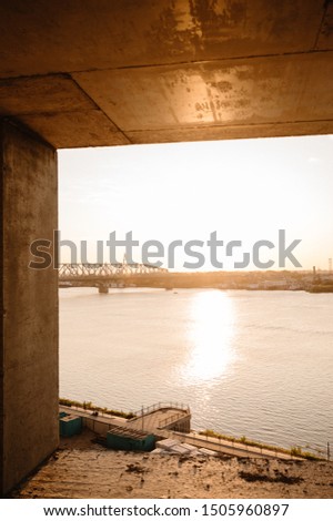 view of the city and river from a house under construction.Cityscape. Dawn in the morning.