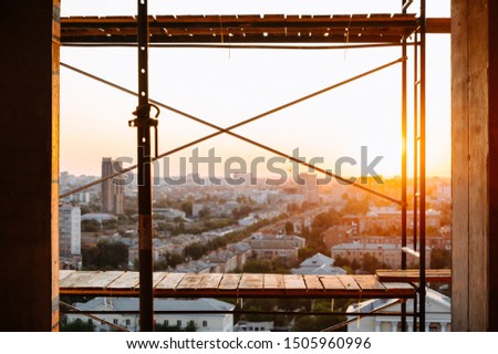 view of the city from a house under construction.Cityscape. Dawn in the morning.