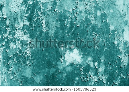 Grungy rusted metal wall surface in cyan tone. Abstract background and texture.