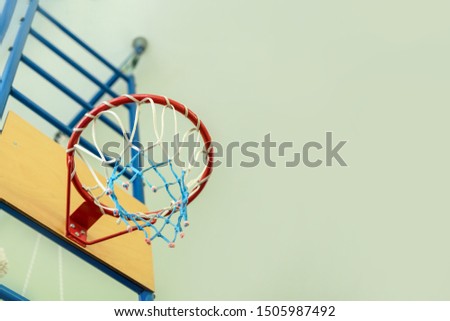 basketball hoop in children gym at school or college bottom view, copy space