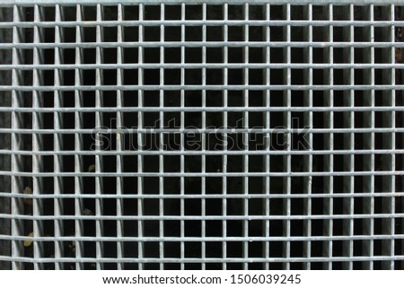 Picture of a grid over drainage that can be used as a background with text space