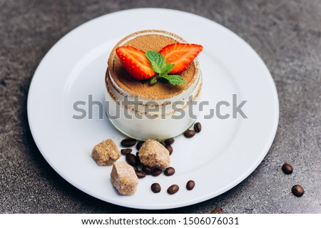 Panakota fresh cream dessert with strawberries and chocolate.