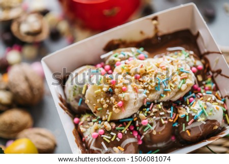 
turkish bite dessert with chocolate and white chocolate sauce. strawberry and banana new generation bite