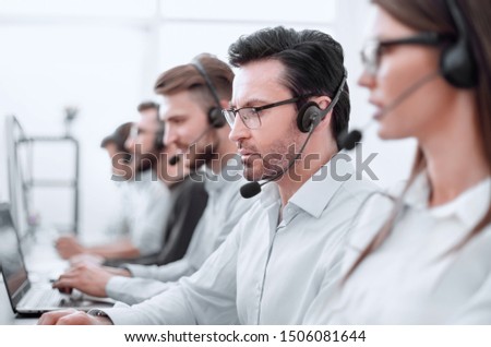 close up.background image of call center employees in the workplace Royalty-Free Stock Photo #1506081644